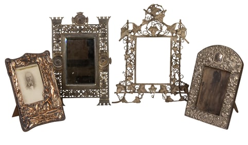 Four silvered photograph frames or mirrors