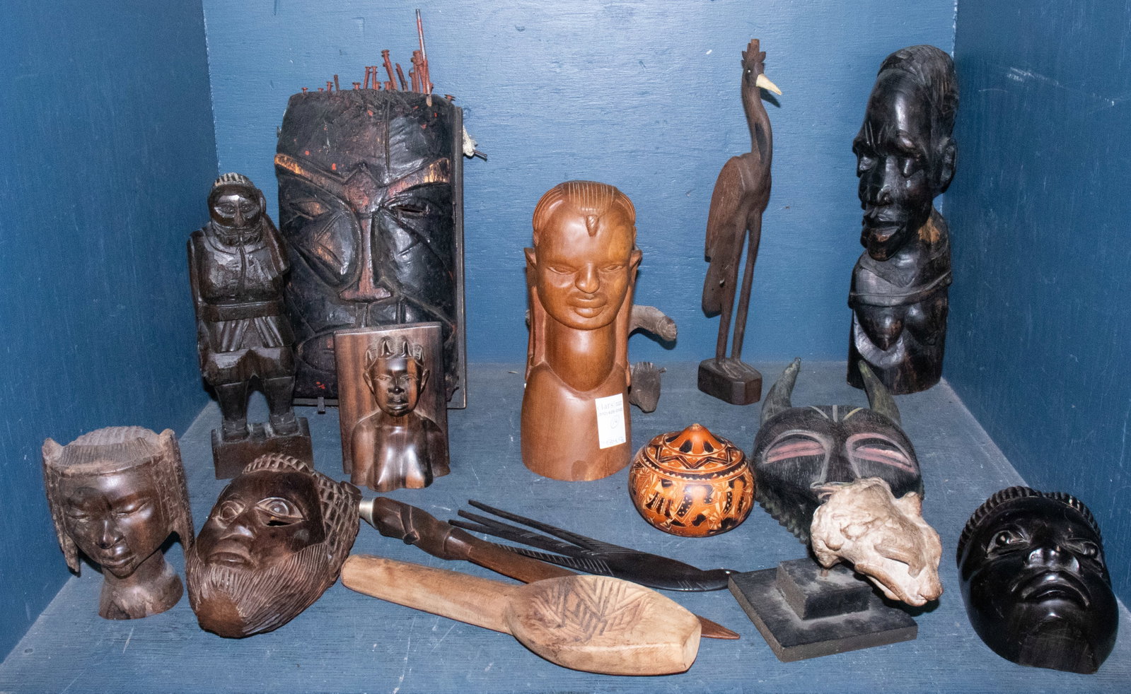 A collection of African, Pre-Columbian & other wood and ceramic figures: A collection of wood and ceramic figures, including African, Pre-Columbian and Cuban examples, together with a ceramic cat head on stand, 4.25"h [16 total]