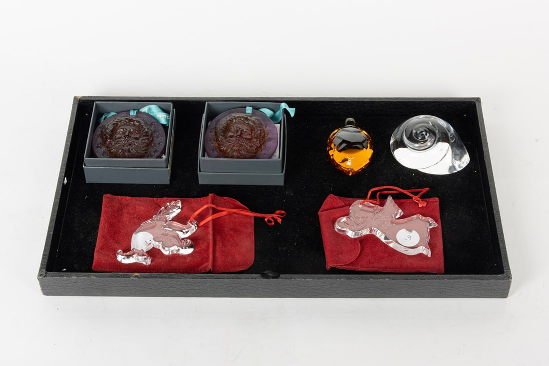A group of glass including Daum, Baccarat and Steuben: A group of glass, comprising (2) Daum pate de verre Christmas ornaments, in boxes, 2.5"dia; Steuben snail paper weight; Baccarat amber glass turtle, 2.75"l and (2) Baccarat Christmas ornaments, 3"h