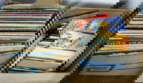 A group of books and LP records in two boxes