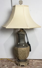An Asian style ceramic table lamp with shade