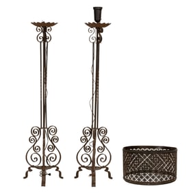 A pair of Spanish Baroque style iron floor prickets
