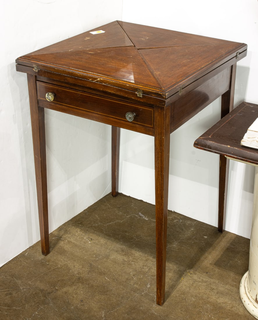 An English inlaid handkerchief table: An English inlaid handkerchief table, 28?h x 21?w x 21?w (closed)
