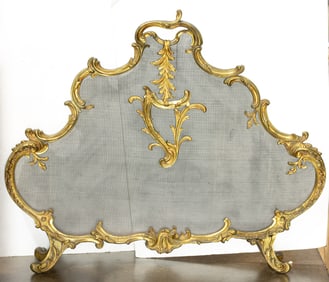 A Louis XV style bronze firescreen of cartouche form