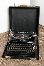 A Remington 5 portable manual typewriter with carrying case