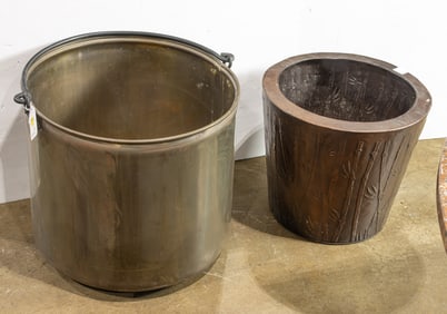 A large brass cauldron with iron swing handle