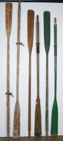 A group of six wood boat oars