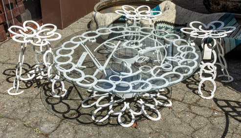 A five piece vintage horseshoe table with stools