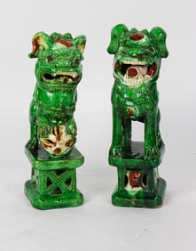 A pair of Chinese sancai glazed foo dogs