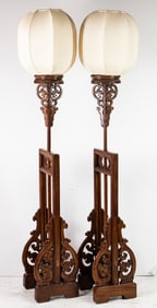 A pair of Chinese elmwood floor lanterns