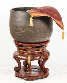 An Japanese bronze meditation bowl and lacquered stand