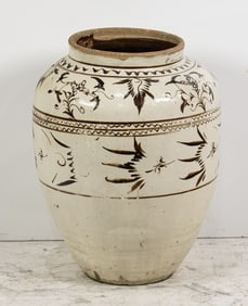 A Chinese Cizhou ware brown and white glazed jar