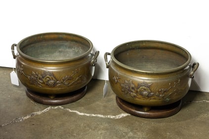 A pair of Japanese bronze jardineres