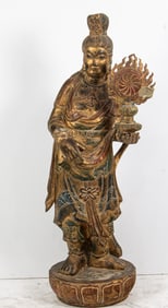 A Chinese polychromed and gilt wood figure of Guanyin