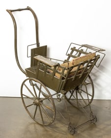 A child’s wood and metal stroller, late 19th century