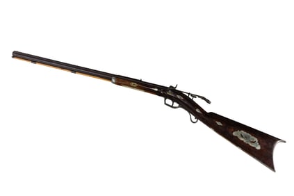 An antique percussion cap muzzle loader