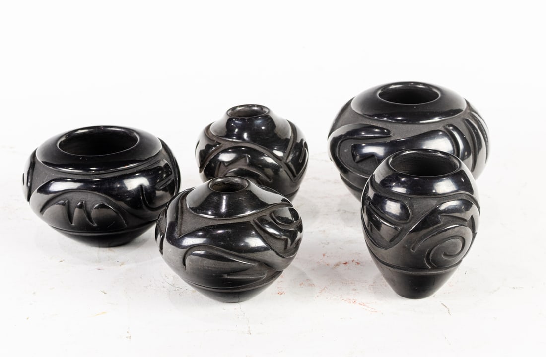 A group of five Denise Chavarria (b.1959) Santa Clara Pueblo carved blackware jars (1 of 3)