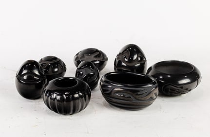A group of seven Santa Clara Pueblo carved blackware vessels