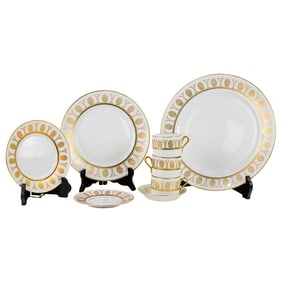 A Richard Ginori porcelain dinner service in the 'Pompeii Gold' pattern