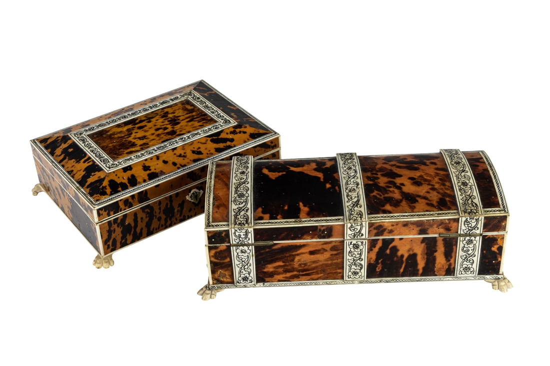 Two Anglo-Indian engraved bone mounted table boxes: Two Anglo-Indian engraved bone mounted table boxes, 19th century, each raised on animal paw feet, the first 3"h x 9"w x 6.5"d; the second 3.25"h x 10.75"w x 5"d