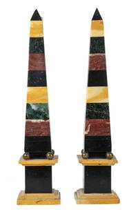 A pair of Italian Neoclassical Grand Tour pietra dura marble obelisks: A pair of Italian Neoclassical pietra dura marble obelisks, early 19th century, each shaft composed of alternating specimen stone on ball feet and pedestal, 20"h x 4.5"w x 4.5"d. Provenance: Property