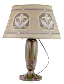 An American Arts and Crafts patinated metal table lamp with Rembrandt stenciled mesh shade