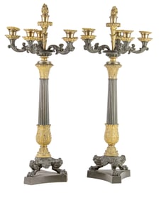 A pair of Louis Philippe patinated and gilt bronze six light convertible candelabra
