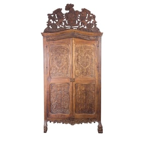 A Continental Rococo style carved armoire, 18th century