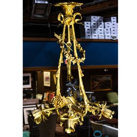 A Belle Epoque patinated and gilt bronze six-light chandelier