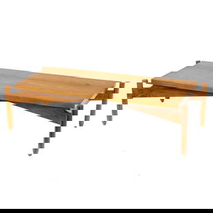 A Modern Brazilian hardwood coffee table: A Modern Brazilian hardwood coffee table, the rectangular top resting on X-shaped frame with dowel legs, 13.5" h x 22.75"d x 51.5"w