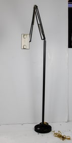 A Modem floor lamp with Jac Jabobsen lamp raised on a gear base