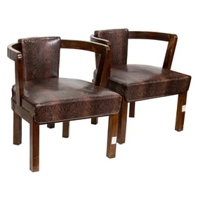 A pair of James Mont stained walnut and faux snakeskin-upholstered oxbow armchairs