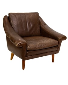 A Danish Modern dark brown leather upholstered lounge chair, circa 1960?s