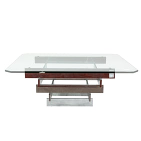 A Modernist glass top coffee table in the manner of Paul Mayan