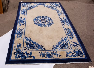 A Chinese ivory ground carpet with circular medallion, 4' x 6'8"