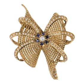 A sapphire, cultured pearl, and 14k gold brooch