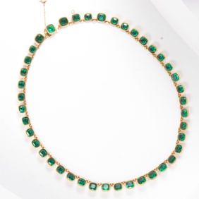 An antique paste and high karat gold necklace and earring set