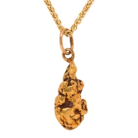 A gold nugget pendant and 14k gold chain