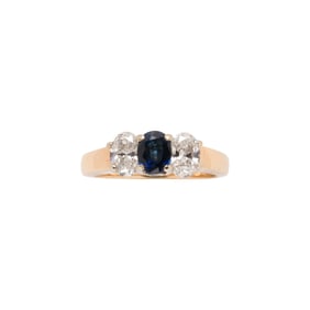 A sapphire, diamond, and 14k gold ring