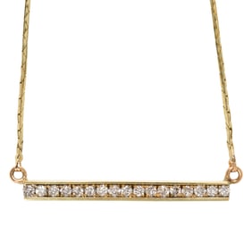 A diamond and 14k gold necklace