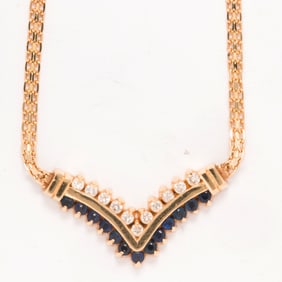 A diamond, sapphire, and 14k gold necklace