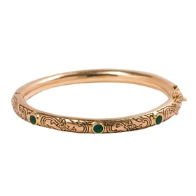 An antique emerald and 14k gold bangle bracelet