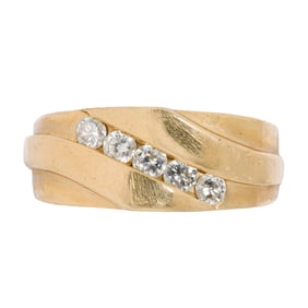 A diamond and 14k gold ring