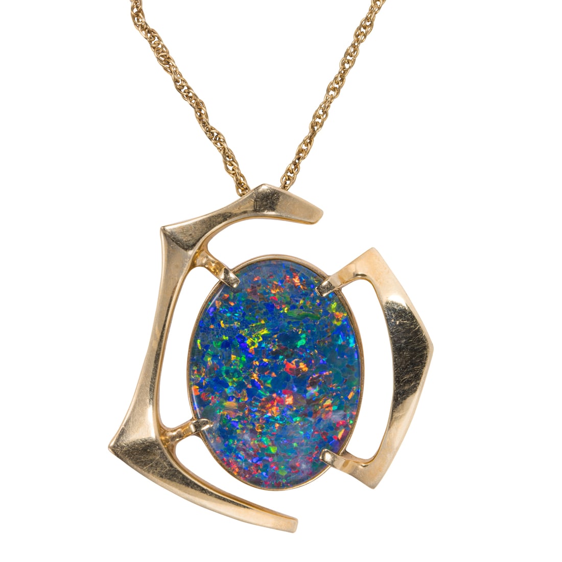 An opal and 14k gold necklace: An opal and 14k gold necklaceCentering an opal triplet measuring approximately 15.5 x 20 mm, within gold geometric features; 9.73 grams; length: 18 in