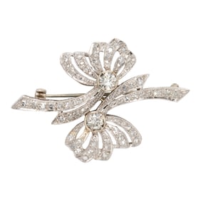 A diamond and 14k white gold brooch