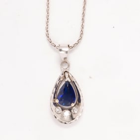 A diamond, sapphire, and platinum necklace