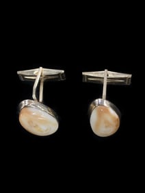 A pair of elk tooth and 14k gold cufflinks