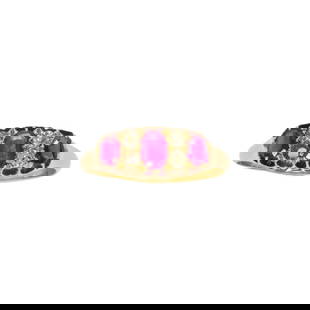 A Victorian ruby, diamond and 18k gold ring: A Victorian ruby, diamond and 18k gold ringcentering an oval-cut ruby weighing approximately 0.30 carat, flanked by two smaller oval-cut rubies each weighing approximately 0.20 carat, and three mine-c
