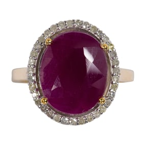A ruby, diamond, silver and 14k gold ring