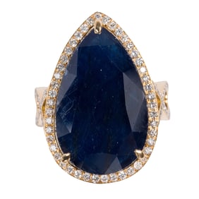 A sapphire, diamond, and 18k gold ring